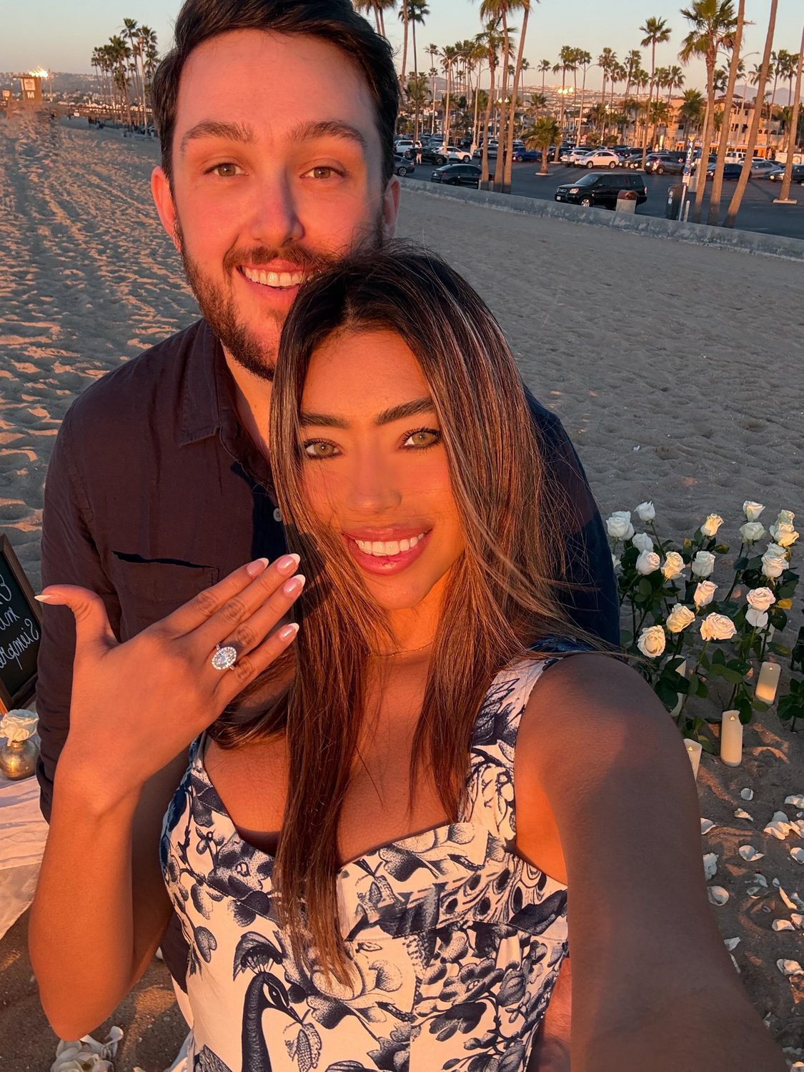 Linda showing her ring, both of them beaming